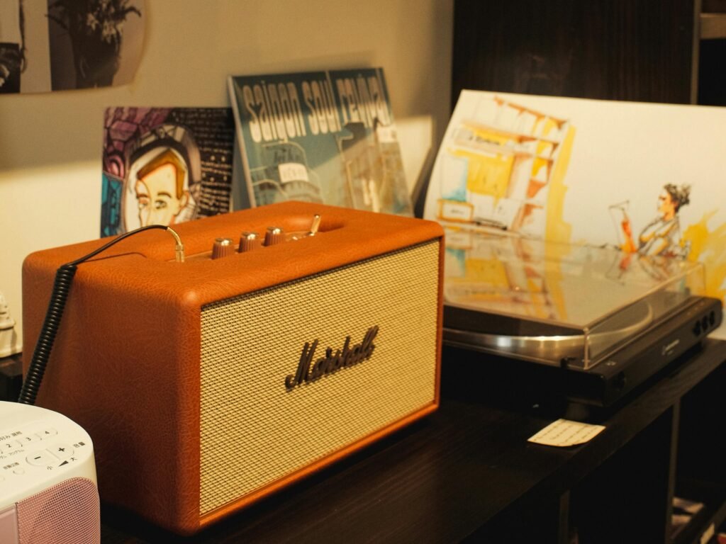 A cozy room showcasing a vintage speaker with records and a turntable, creating a retro vibe.